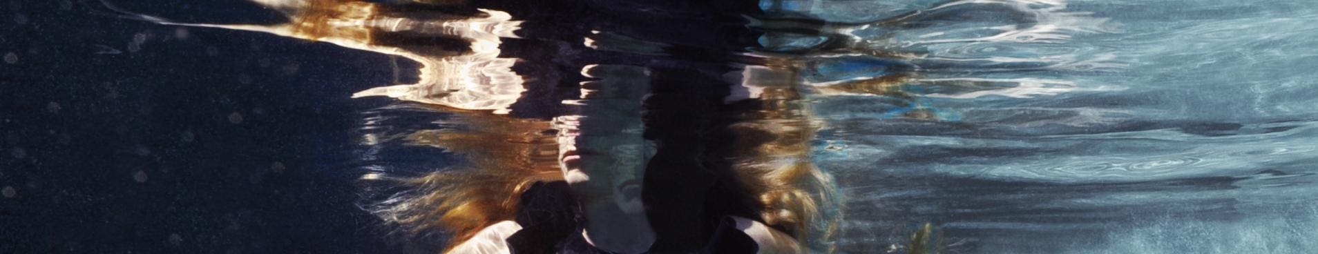 a person's face under water